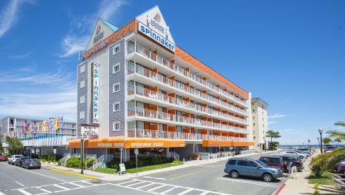 a large hotel on a street with a parking lot at The Spinnaker in Ocean City