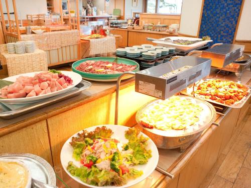 a buffet line with many different types of food at Toya Kohan Tei in Lake Toya