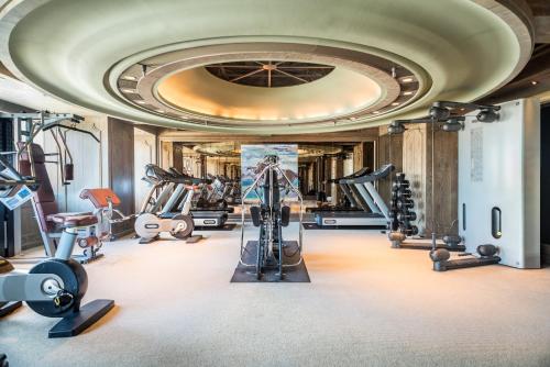 a gym with treadmills ellipticals and exercise equipment at Palais de Chine Hotel in Taipei
