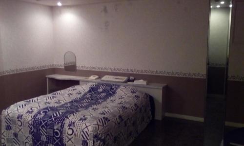 a bedroom with a bed and a vanity with a mirror at Hotel Tea Time (Love Hotel) in Nagasaki