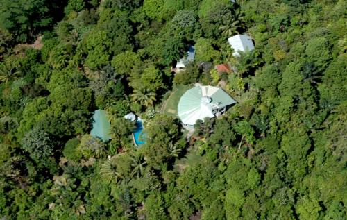 an aerial view of a forest with a water tower at Puncak Air Manis Residence in Padang