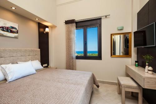 a bedroom with a large bed and a window at Villa Stellina in Marathokefála