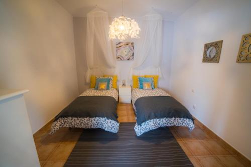 En eller flere senge i et værelse på Casa El Cerco