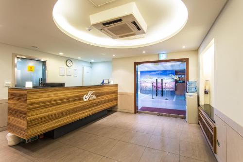 a lobby with a reception desk in a building at Incheon Airtel in Incheon