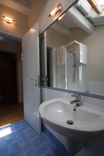 a bathroom with a white sink and a mirror at Agriturismo Casa Rossi di Paolo Rossi in Numana
