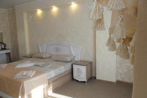 Una cama o camas en una habitación de Hotel Kama