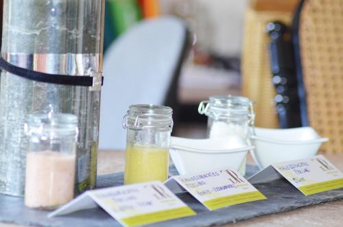 a table with two jars of food and a blender at Georg Rass Gästehaus in Norderney