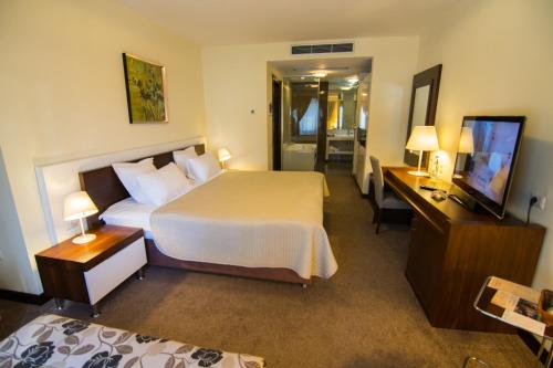 Postel nebo postele na pokoji v ubytování Boutique Hotel Kotoni
