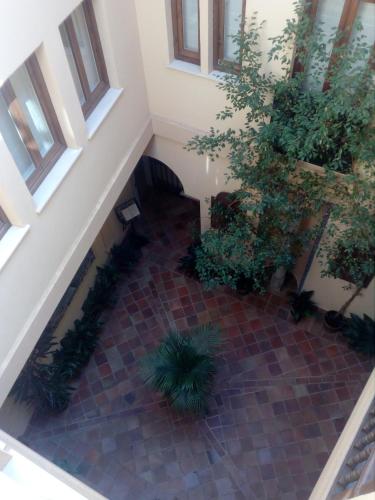 an overhead view of a stairway with plants at Ático Las termas in Toledo