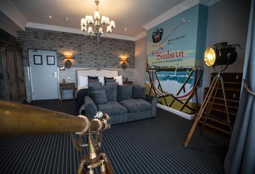 a bedroom with a couch and a camera in a room at Roker Hotel BW Premier Collection in Sunderland