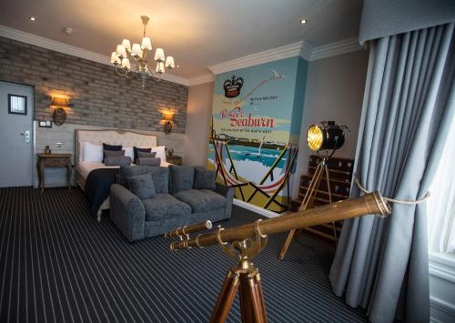 a room with a bedroom with a bed and a camera at Roker Hotel BW Premier Collection in Sunderland