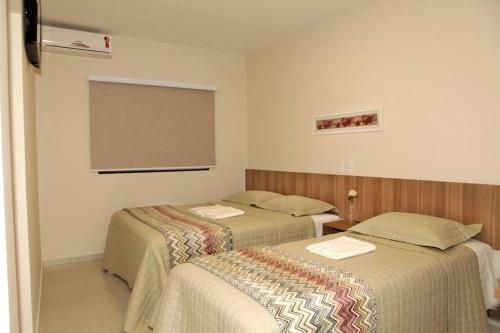 Ένα ή περισσότερα κρεβάτια σε δωμάτιο στο Siena Hotel