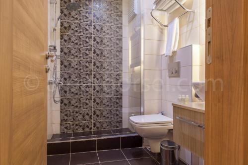 Ванна кімната в Kavalalı Suites