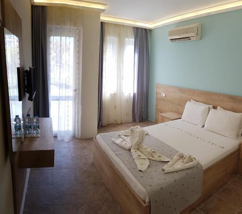 Ένα ή περισσότερα κρεβάτια σε δωμάτιο στο Tunacan Hotel