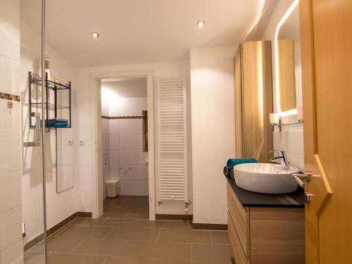 a bathroom with a sink and a toilet in it at Appartement Pichler in Altenmarkt im Pongau