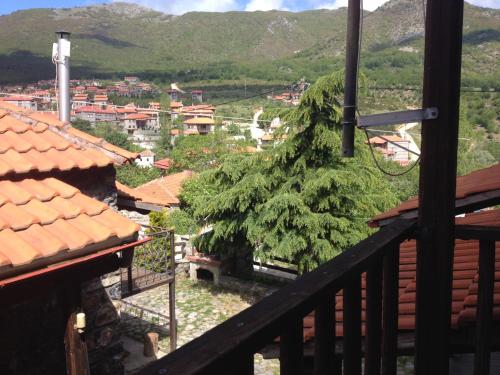 a view of a town from the balcony of a house at Chalet Asteras tou Vorra in Palaios Agios Athanasios