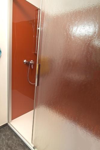 a shower with a glass door in a bathroom at Ferienwohnungen Petschnig 2 in Drobollach am Faakersee