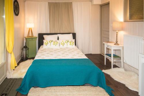 Кровать или кровати в номере Le Balcon