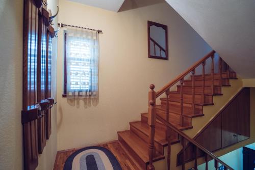 a staircase in a house with a window at Ivica Apartments in Imotski