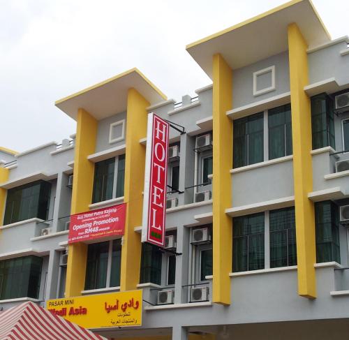 a building with a hotel sign in front of it at ECO Hotel Putra Kajang in Kajang