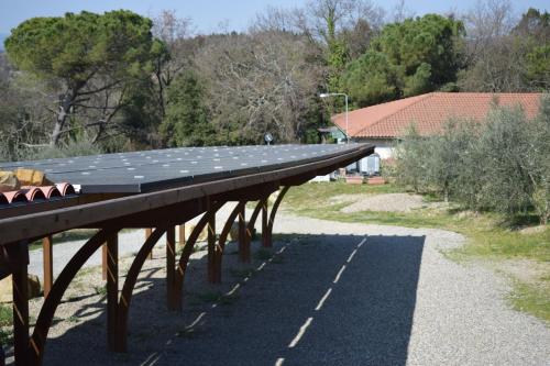 a solar roof on top of a building at Agriturismo Amina, Winery & Hiking in Vagliagli