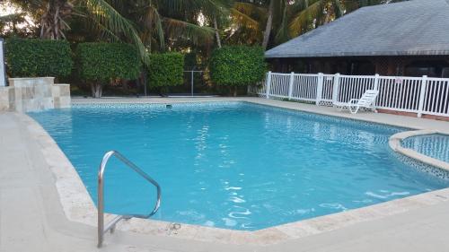 a large swimming pool with blue water at Combate Beach Resort in Cabo Rojo