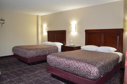a hotel room with two beds in a room at Economy Inn in Portland
