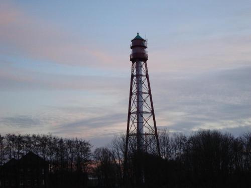 a water tower with a sky in the background at Leezdorfer Hof in Leezdorf