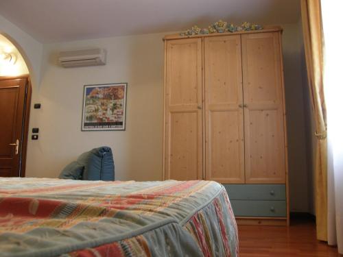 Un pat sau paturi într-o cameră la Residence Meuble' Cortina