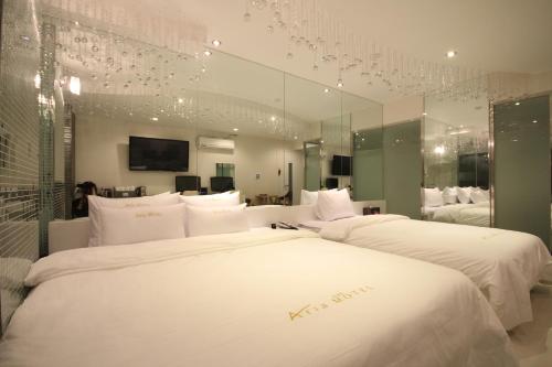 Кровать или кровати в номере Boutique Hotel Aria Nampo