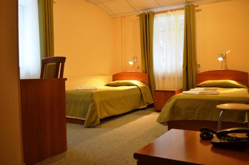 Кровать или кровати в номере Ринальди на Васильевском