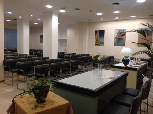 a large room with chairs and a waiting room at Hotel Palace Masoanri's in Reggio Calabria