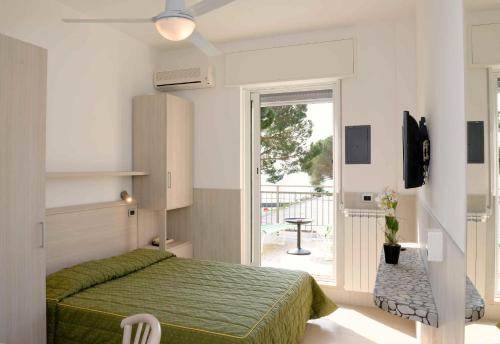 Una cama o camas en una habitación de Hotel Puntabella