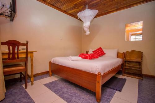 Cama ou camas em um quarto em Sunshine Hotel Tengecha