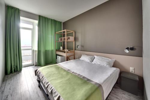 Säng eller sängar i ett rum på Hotel Vesna