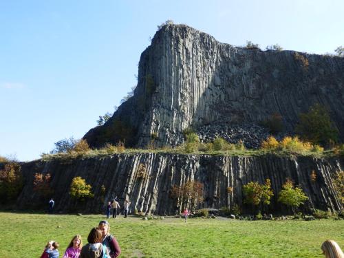 a group of people standing in a field in front of a mountain at Liszkay Borkúria in Monoszló