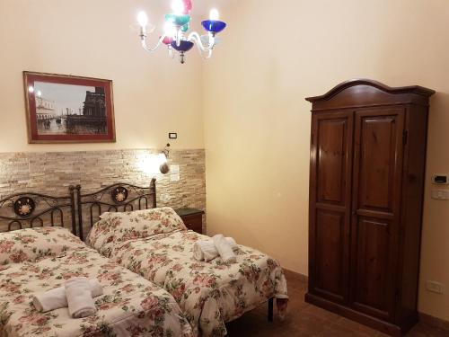 Säng eller sängar i ett rum på Hotel Il Casolare