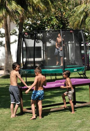 a group of children playing on a trampoline at Pullman Mazagan Royal Golf & Spa in El Jadida
