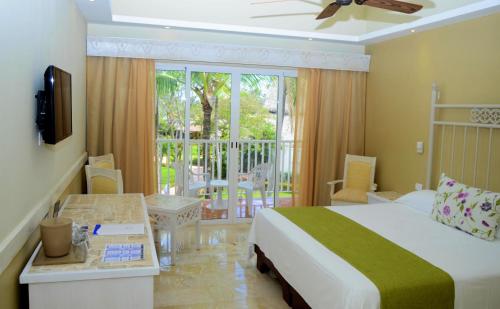 a hotel room with a bed and a balcony at VIK hotel Arena Blanca in Punta Cana