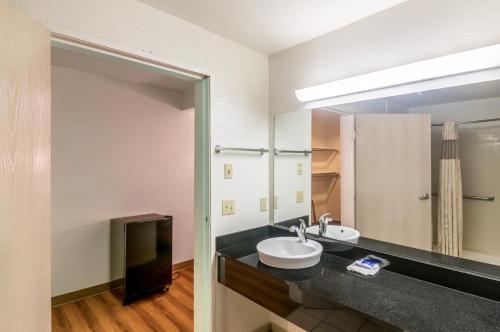a bathroom with a sink and a mirror at Motel 6-Oklahoma City, OK in Oklahoma City