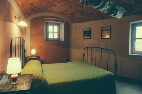 En eller flere senger på et rom på La Vigna Del Maestro