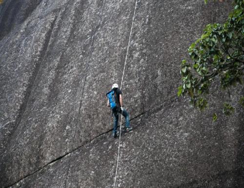a man walking on a zip line at Monte Mágico in Támesis