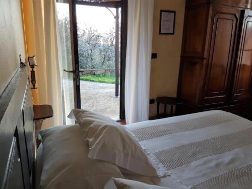 Ένα ή περισσότερα κρεβάτια σε δωμάτιο στο Agriturismo Borgo La Casetta