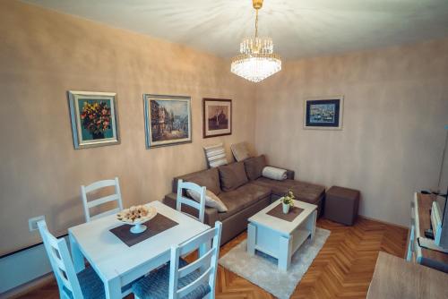 a living room with a couch and a table at Ivica Apartments in Imotski
