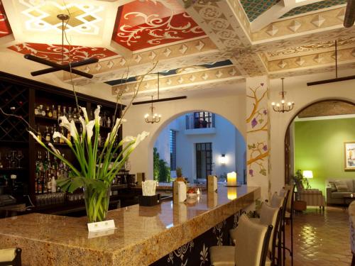 a bar in the lobby of a restaurant at Guaycura Boutique Hotel, Beach Club & Spa in Todos Santos