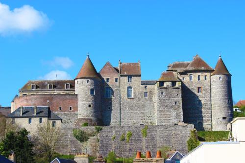 a large castle on top of a hill at L'Échappée - Hôtel Casino Dieppe in Dieppe