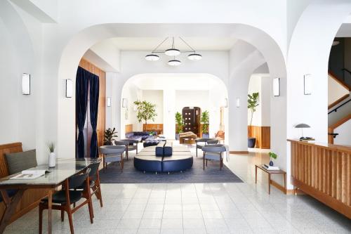a living room with a couch and a table at Tilden Hotel Union Square in San Francisco