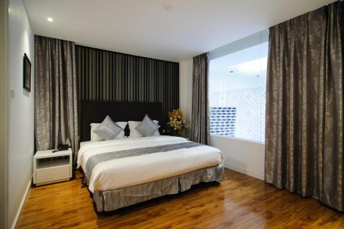 Ένα ή περισσότερα κρεβάτια σε δωμάτιο στο Riverside Boutique Hotel