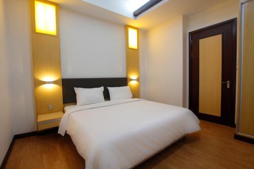Postel nebo postele na pokoji v ubytování Bay Resort by Imperial Suites Miri , Diamond Tower