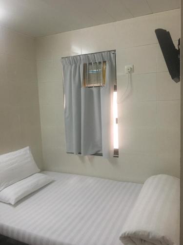 Postel nebo postele na pokoji v ubytování Unique Hostel
